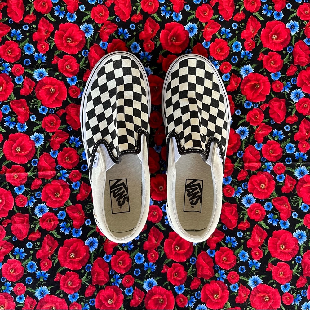 Vans black and white checkered slip-ons